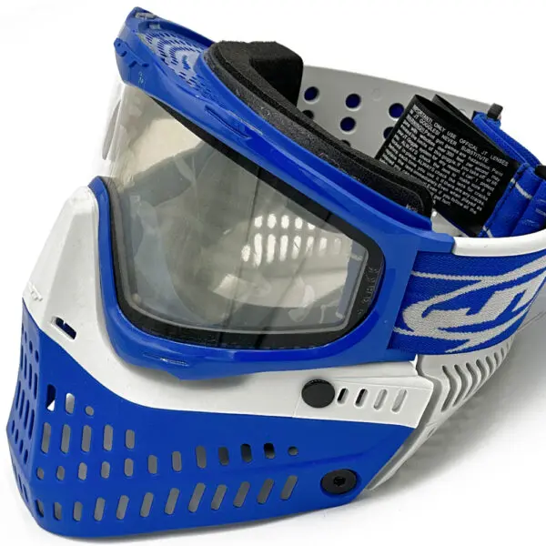Blue and white paintball mask with clear lens.