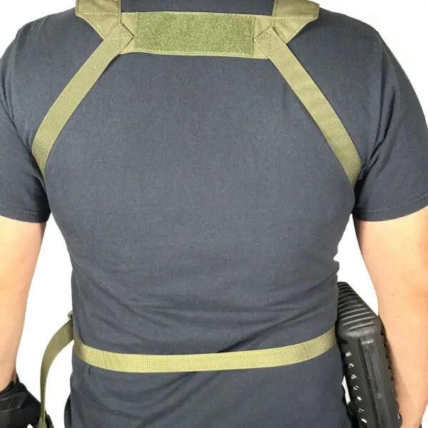 Person wearing a green tactical harness.
