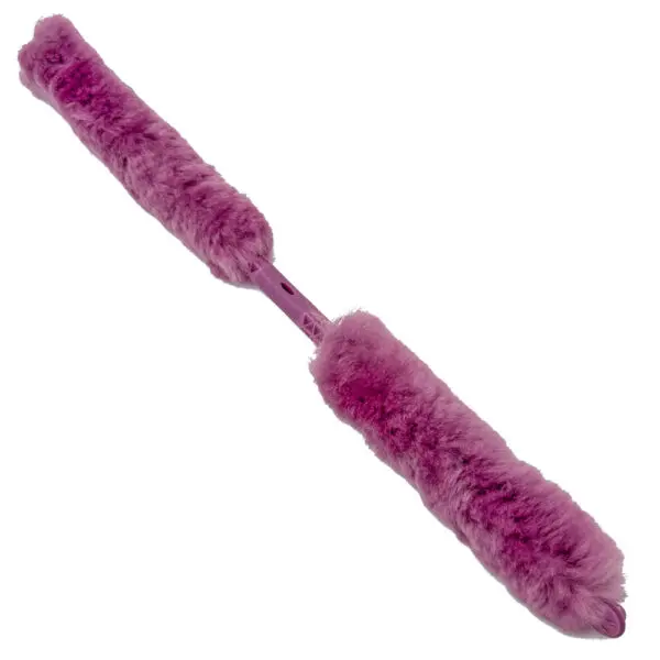 Pink feather duster isolated on white.