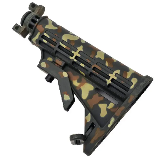 Camouflaged AR-15 stock assembly.