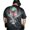 Man wearing helmet and graphic t-shirt.