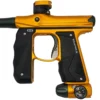 Gold and black paintball marker gun.